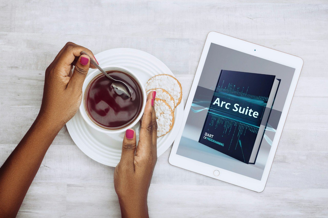 Person holding a cup of coffee with a tablet displaying 'Arc Suite' on a light surface