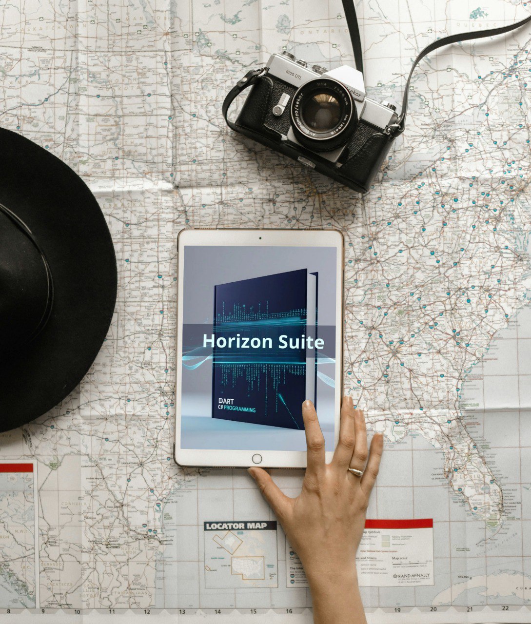 Tablet displaying 'Horizon Suite' on a map with a camera and hat nearby